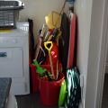 Lots of beach toys including spades, buckets, and body boards. Tennis rackets as well