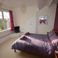 Bedroom with king sized bed and ensuite.
